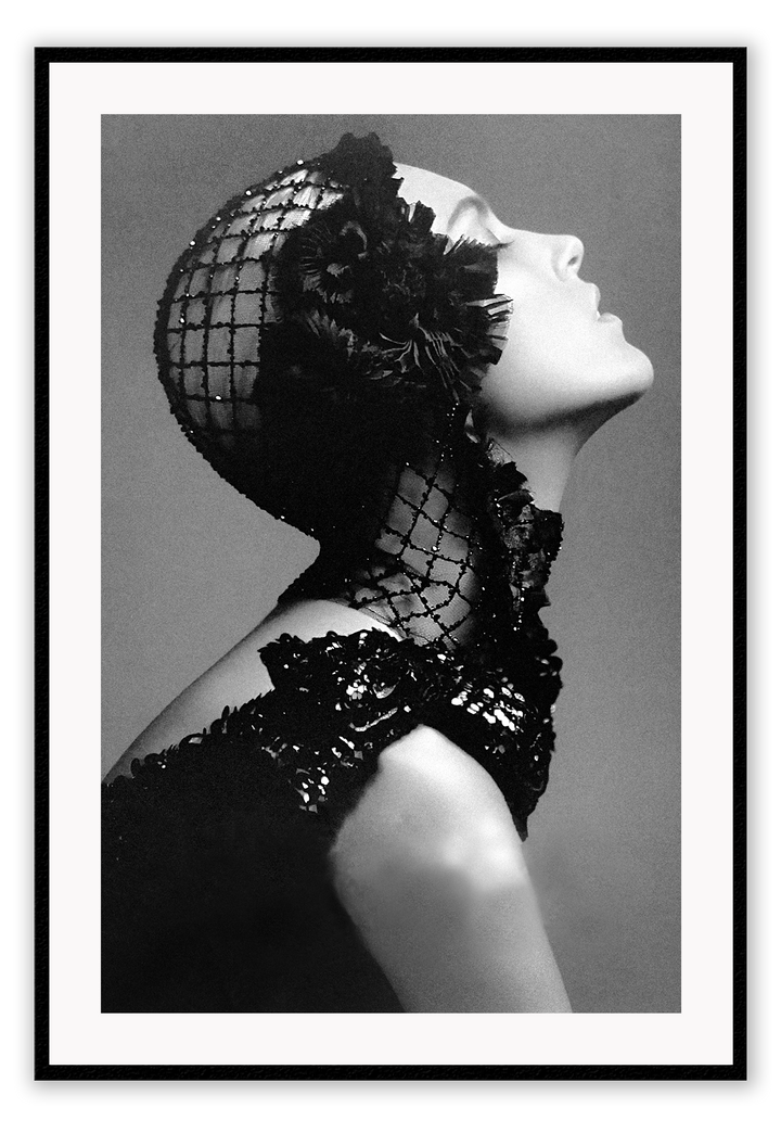 A black and white, vintage fashion wall art with Coco chanel woman wearing black lace flower. 