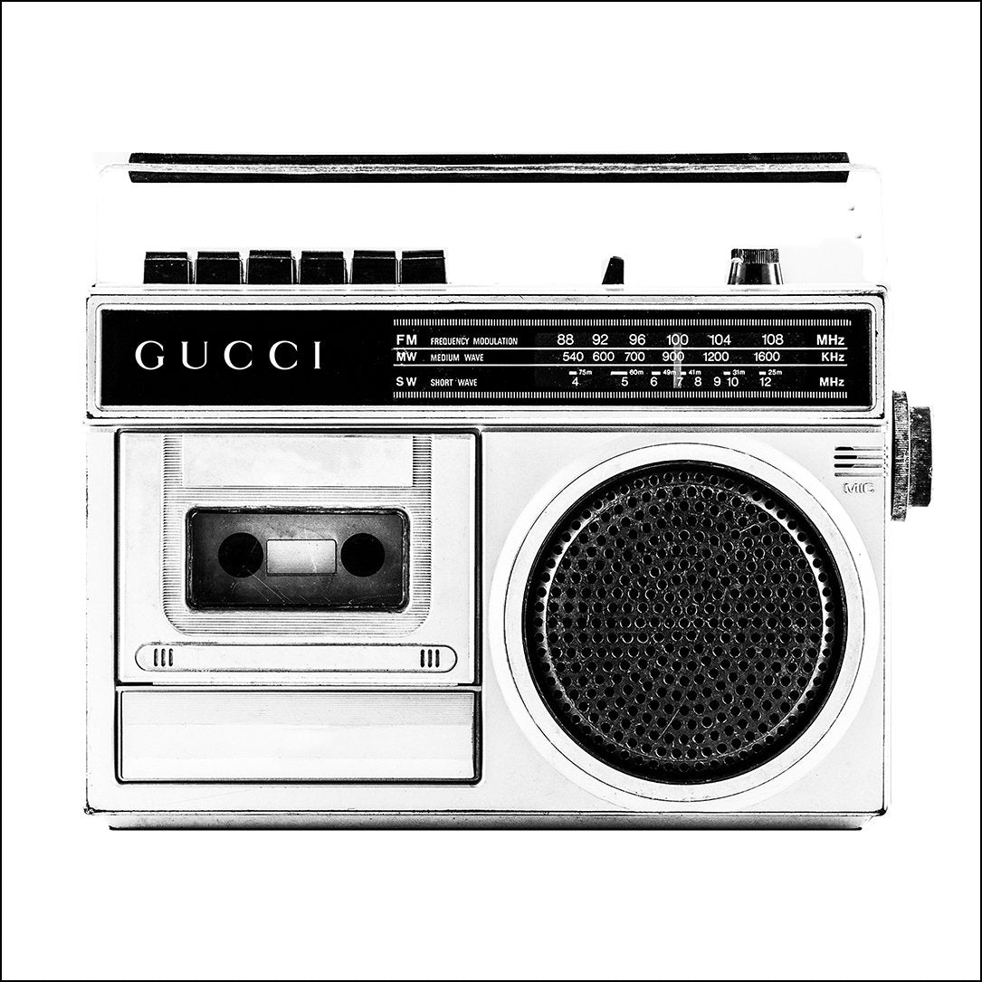 A vintage fashion wall art with Gucci fashion label on 80s 90s vintage recorder in black and white. 