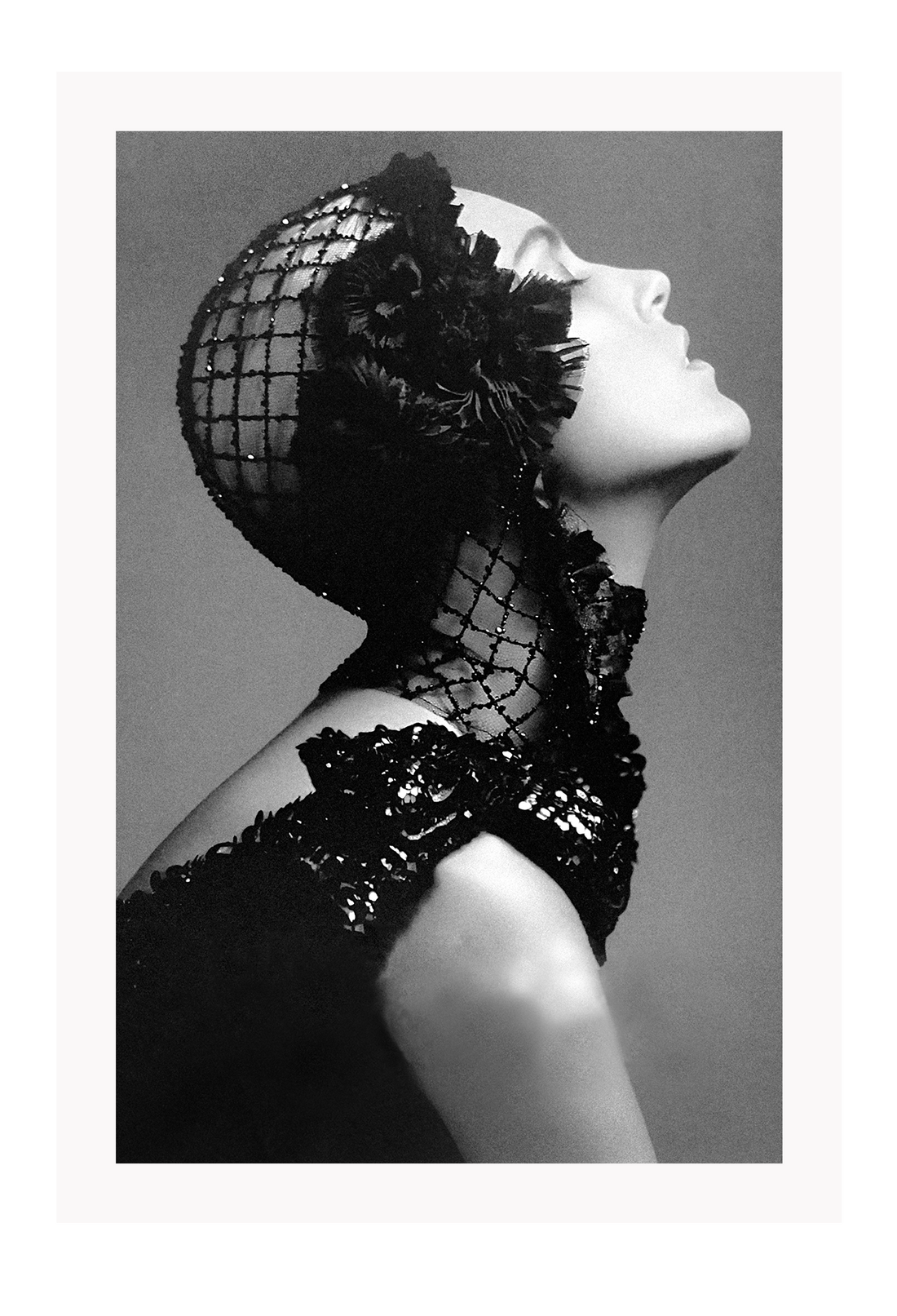 A black and white, vintage fashion wall art with Coco chanel woman wearing black lace flower. 