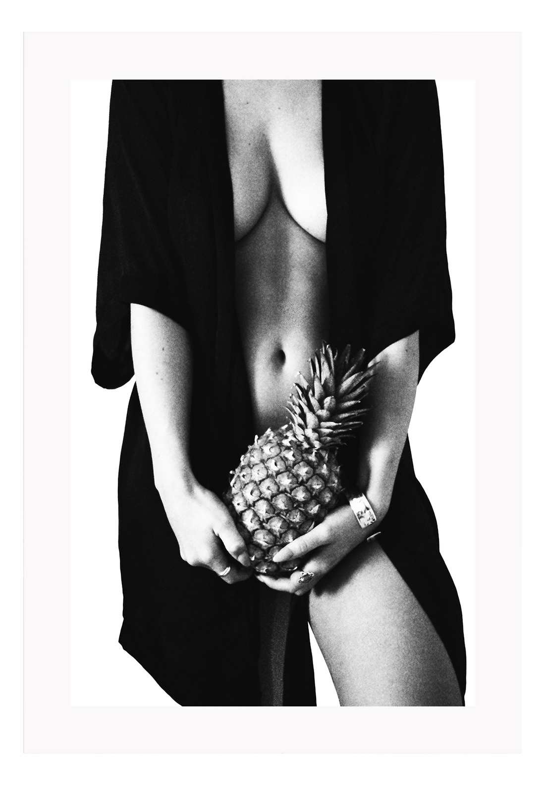 Fashion photography print with nude sexy woman wearing robe holding pinapple in black and white on white background 