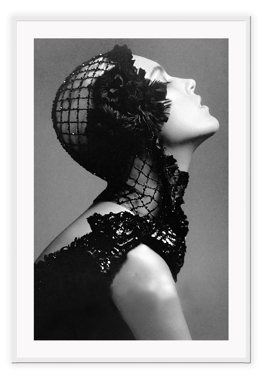 A black and white, vintage fashion wall art with Coco chanel woman wearing black lace flower. 