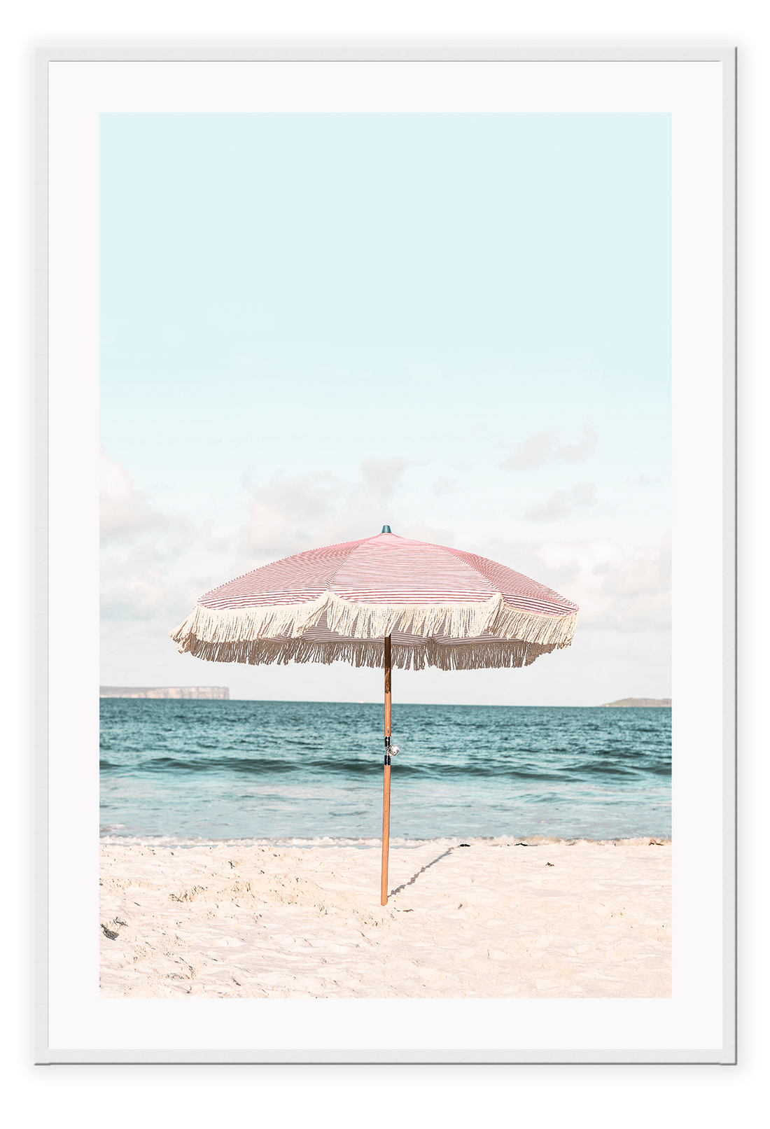 A natural wall art with a pink umbrella on the summer beach in Bali pastel tones and boho style