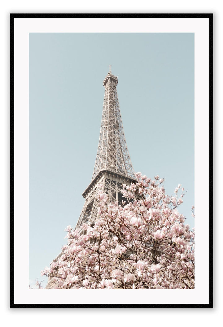 Eiffel tower Paris print with pink cherry blossoms and blue sky, pastel colours and dynamic view 