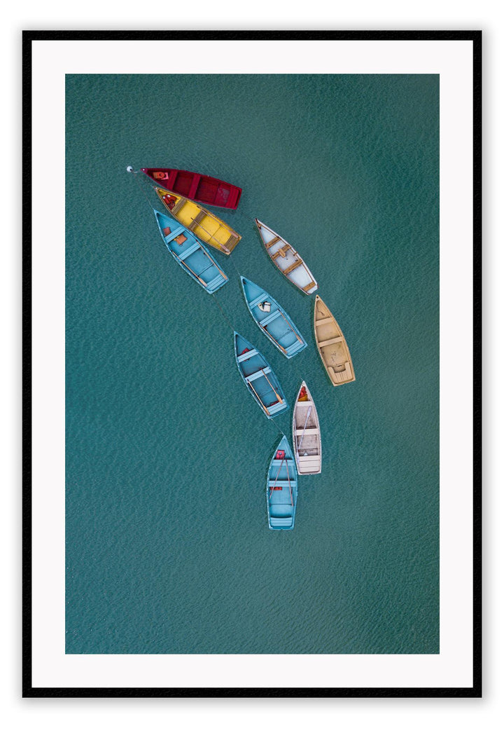 Blue ocean boats on water colourful red yellow beige white in line