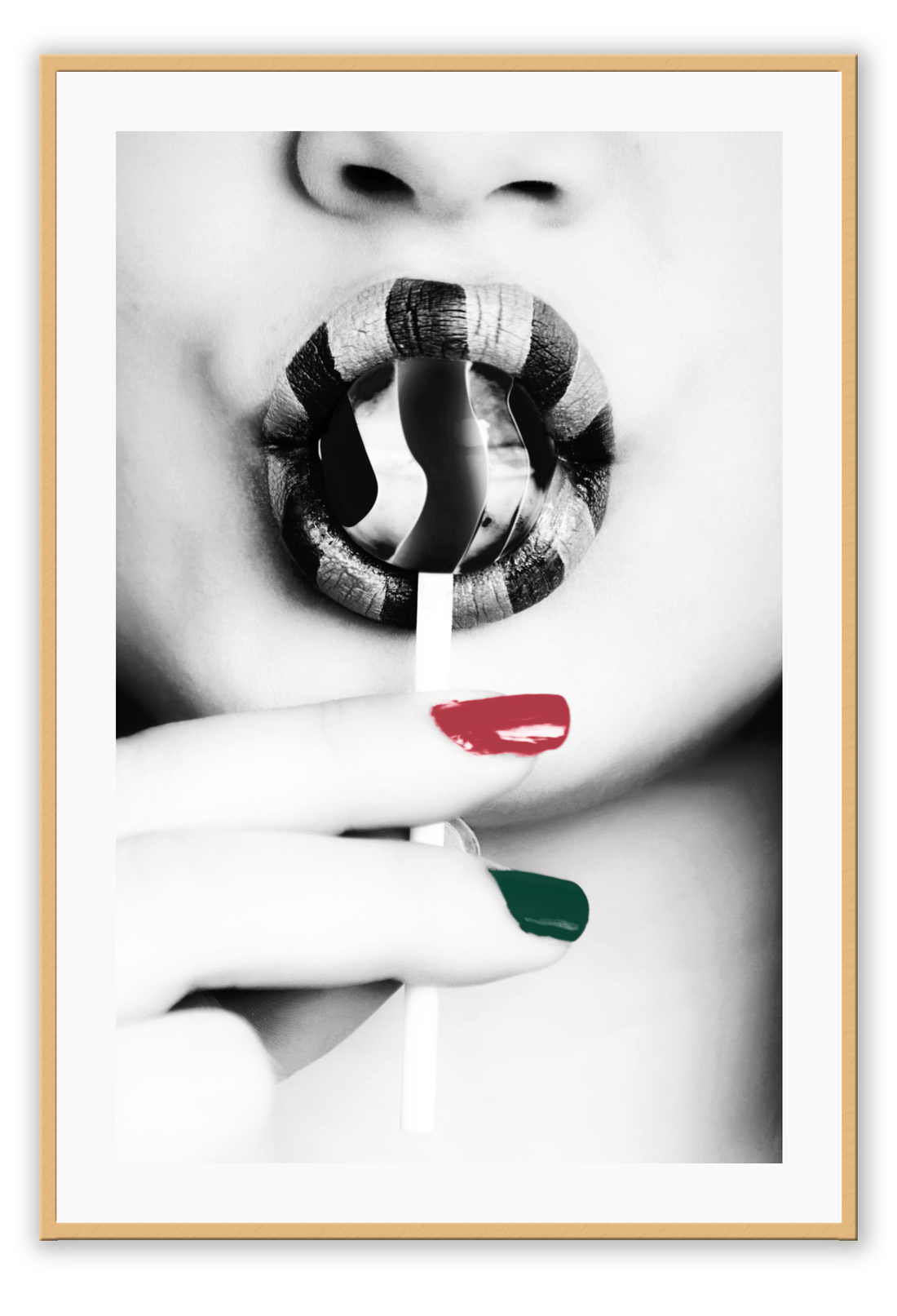 Black and white modern print featuring a woman sucking a lollypop with one green one red finger nail and striped lipstick.